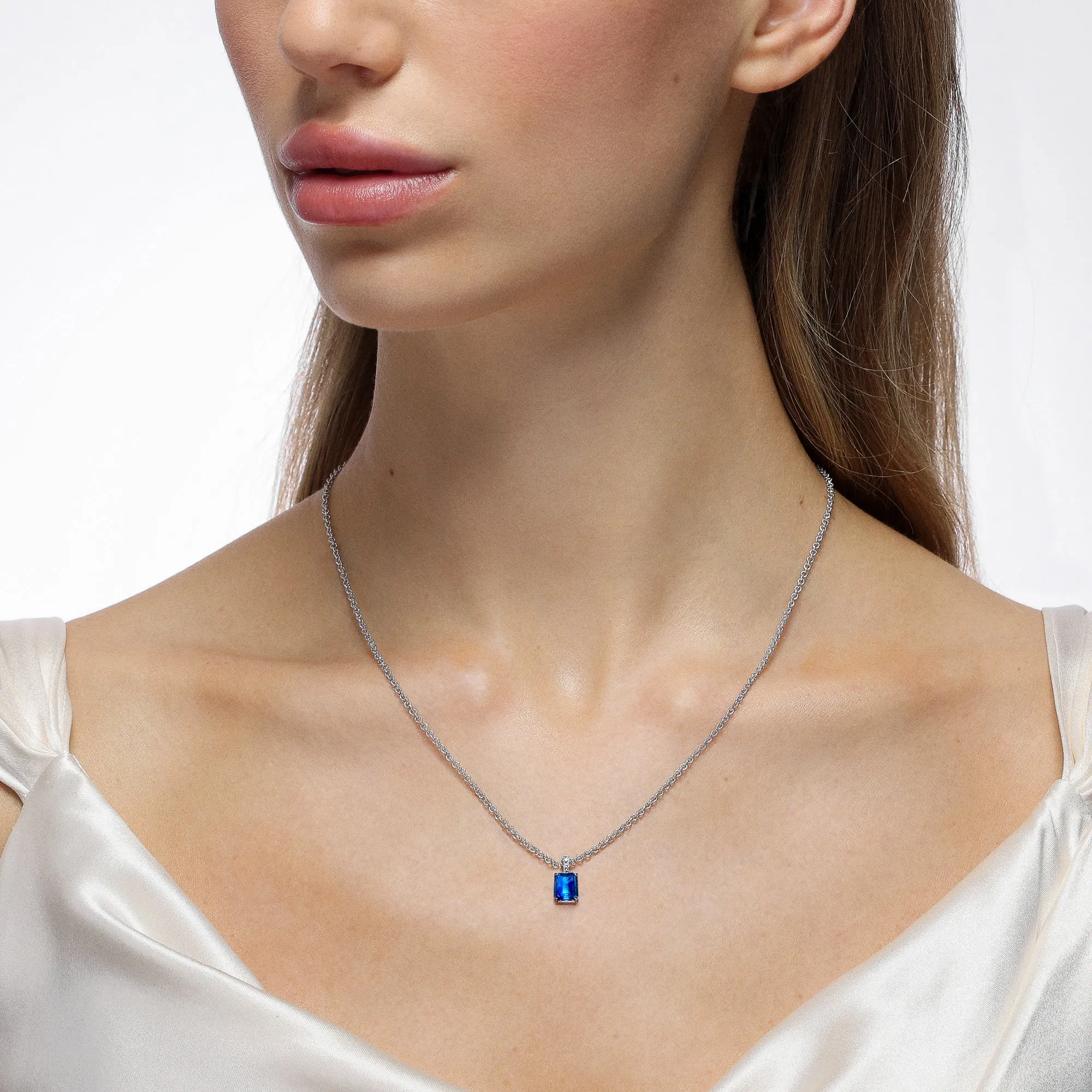 Simple Solitaire Emerald Cut Sapphire Pendant